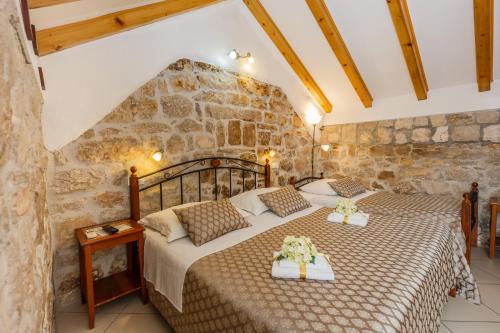 Un pat sau paturi într-o cameră la Villa Spaladium