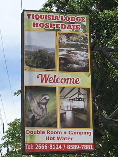 a sign for a househouseordableordable istg istg at Tiquisia Lodge in Curubandé