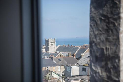 a view of a city from a window at St Breca in Newquay