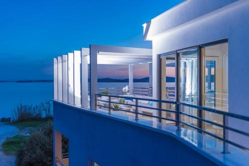 a house with a balcony with a view of the ocean at SeaHouse by Jelena in Bibinje