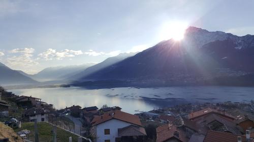 a view of a city and a lake with a mountain at Casa Contadina in Vercana
