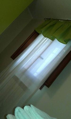 a light on top of a window in a room at B&B Villa Venere in Taranto