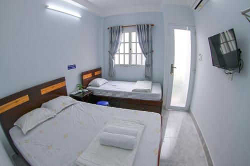 Giường trong phòng chung tại SƠN THỊNH Guesthouse