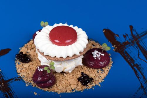 a dessert sitting on top of a blue table at Hotel Eira in Bormio
