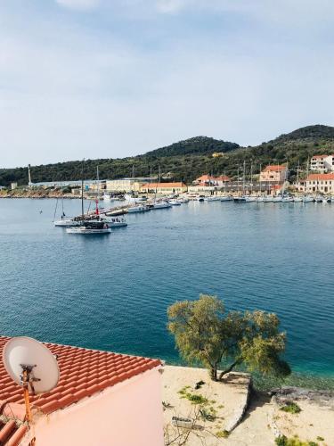 a view of a harbor with boats in the water at Apartmani Sali Seaview in Sali