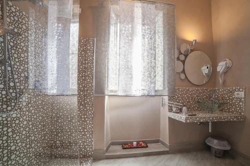 a bathroom with a shower with a shower curtain at Le Stanze d'Ercole in Tivoli