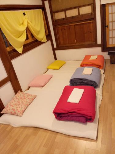 Postel nebo postele na pokoji v ubytování Hundred Years Hanok