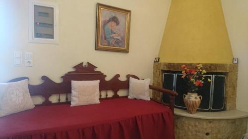 Кровать или кровати в номере Tourloti Village House