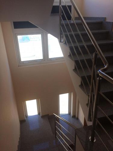 a staircase in a house with a window at Ático con vistas a la ría de Arosa in Rianjo