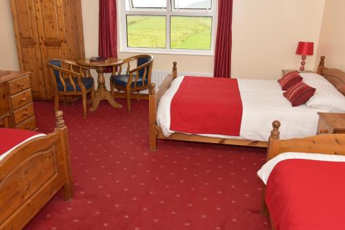Una cama o camas en una habitación de An Bothar Pub