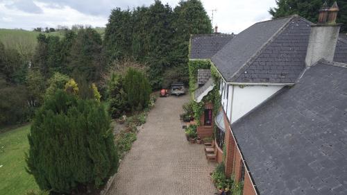 an overhead view of a house with a driveway at Pinewood Lodge Guest House in Omagh