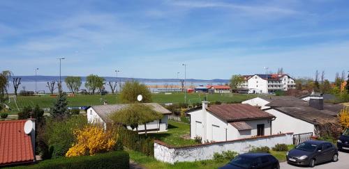 a small town with houses and cars parked at Gästehaus Lokalaugenschein in Podersdorf am See
