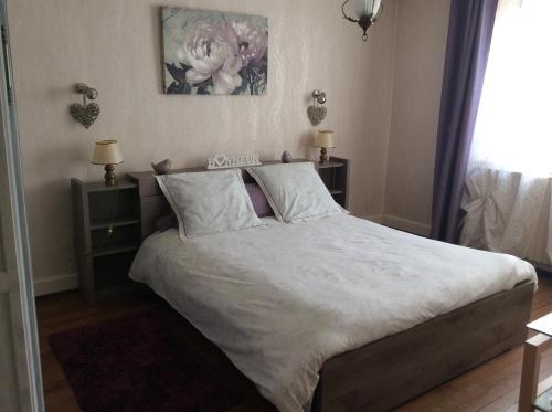 Postel nebo postele na pokoji v ubytování Gîte du Moulin