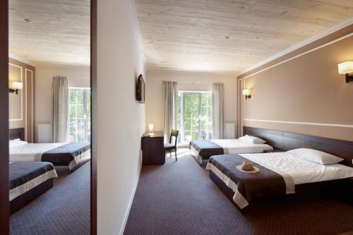 Postel nebo postele na pokoji v ubytování Geneva Resort Hotel