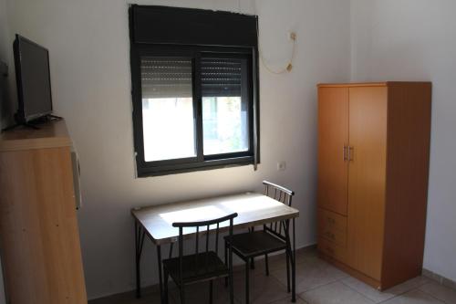 Телевизор и/или развлекательный центр в Apartments With Sea View