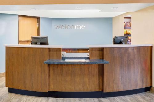 an office with a welcome sign on the wall at Days Inn & Suites by Wyndham Page Lake Powell in Page