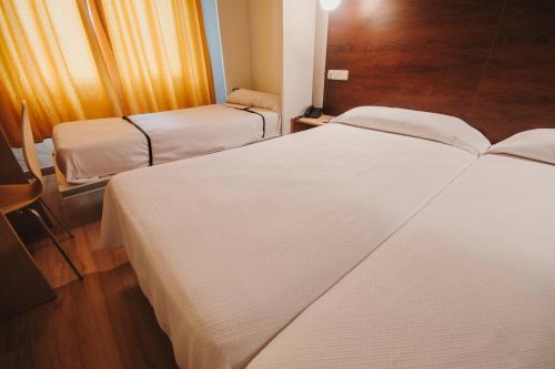 Letto o letti in una camera di Hotel Embajador