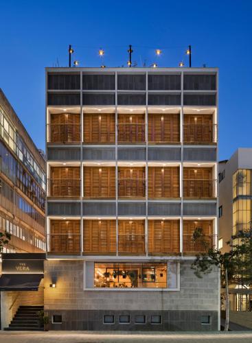 an external view of a building at night at The Vera in Tel Aviv