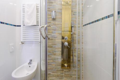 a bathroom with a shower and a sink at Hotel Viking in Rimini