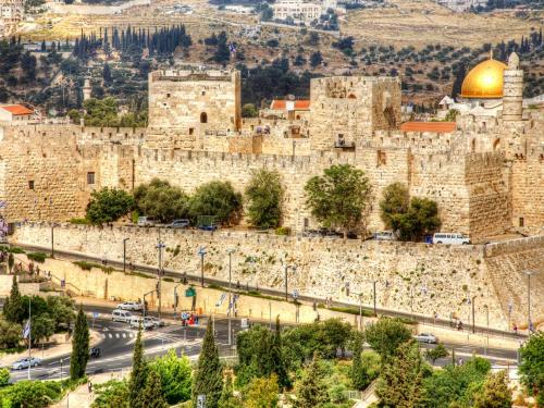 a view of the old city of jerusalem with a mosque at Dan Panorama Jerusalem Hotel in Jerusalem