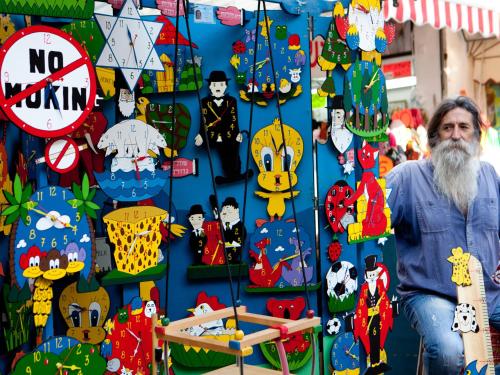 a man standing in front of a wall of christmas ornaments at Dan Panorama Tel Aviv Hotel in Tel Aviv