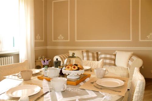 a dining room table with a bowl of food on it at La Valinfiore Charming Home in Montecarlo