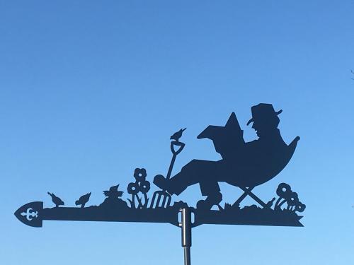 a silhouette of a wizard sitting on a wand at B&B De Hostelier in Ursel