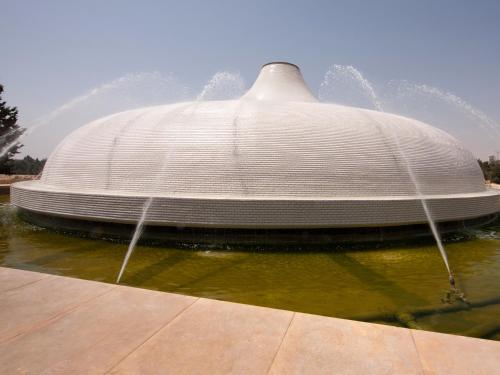 a fountain in the middle of a body of water at Dan Boutique Hotel Jerusalem in Jerusalem