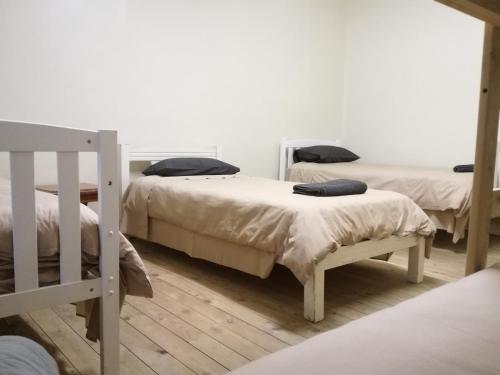 En eller flere senge i et værelse på Paarl Backpackers