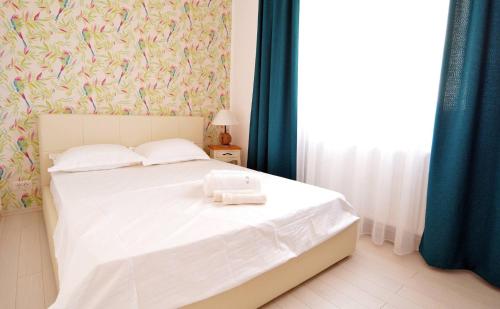 Letto o letti in una camera di Boudoir Tropical Apartments