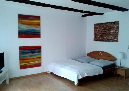 Tempat tidur dalam kamar di Ferienwohnung Das Fuchsrevier