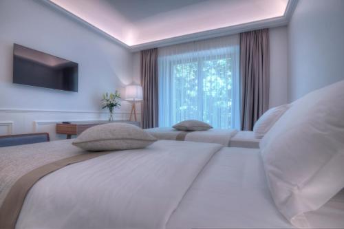 Postel nebo postele na pokoji v ubytování Hotel Majestic