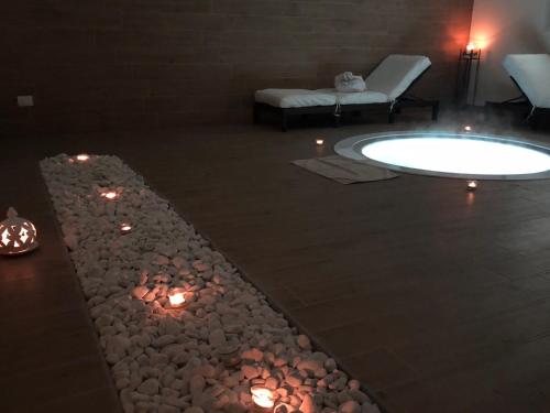 a living room with a pool and a fire pit at Relais Dei Mandorli in Bergamo