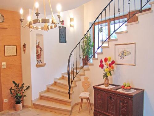 a staircase in a home with a vase of flowers at Pension Apartments Pardell in Castelbello-ciardes
