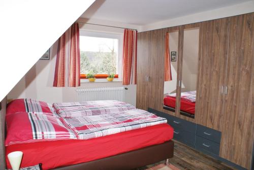 En eller flere senge i et værelse på Ferienwohnung Op de Diek 1