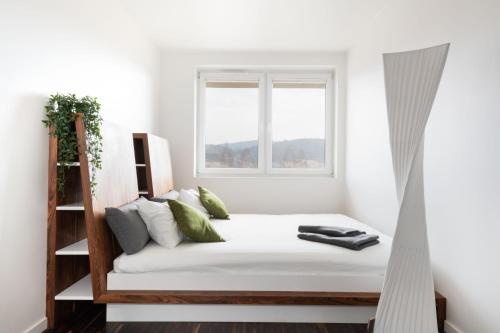 Posteľ alebo postele v izbe v ubytovaní Halna Residence