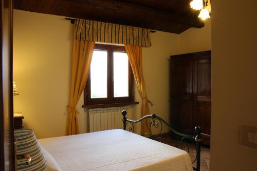 Posteľ alebo postele v izbe v ubytovaní Villa di Castello