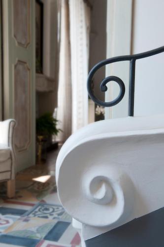 a toilet paper holder with a roll of toilet paper at Casa Buonocore in Positano