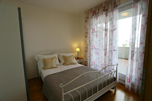 Posteľ alebo postele v izbe v ubytovaní Apartman Lucita