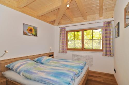 Un pat sau paturi într-o cameră la Haus am Kienberg