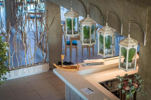 a room with a counter with several glass jars with plants at Broadwater River Estate in Douglas