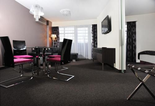 a room with a dining room table and chairs at Hotel 3 Trio in Białystok