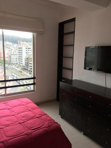 Ένα ή περισσότερα κρεβάτια σε δωμάτιο στο Suites Parque Real