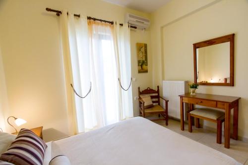 Łóżko lub łóżka w pokoju w obiekcie Villa Alkyon