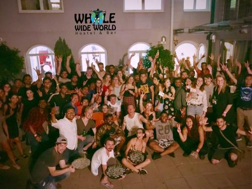 a large group of people posing for a picture at Whole Wide World Hostel in Zagreb