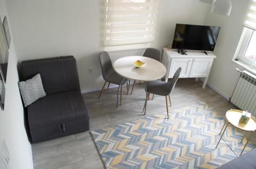 TV a/nebo společenská místnost v ubytování Apartment Fortuna