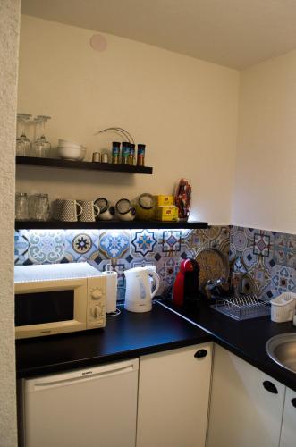Kuchyň nebo kuchyňský kout v ubytování Apartment Fortuna
