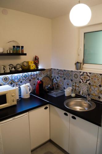 Kuchyň nebo kuchyňský kout v ubytování Apartment Fortuna