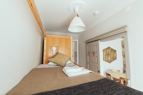 a bedroom with a bed in a room at Bordallo's Prime Apartments in Caldas da Rainha