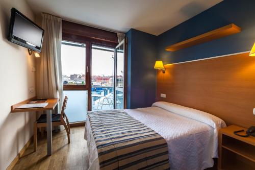 Postel nebo postele na pokoji v ubytování Hotel La Polar